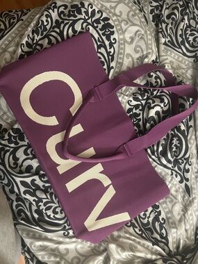 Plum curves by Sean brown Tote Bag